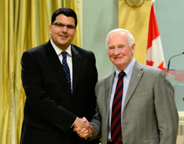 Daniel Ansari (left) alongside David Johnson, Governor General of Canada (right).